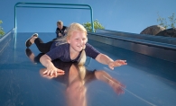 A girl slides down a slide at Central Park in Maple Grove.