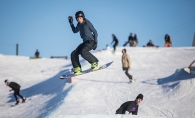 A snowboarder goes airborne at the Elm Creek Park Reserve