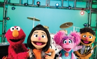 A band of Sesame Street Muppets including Ji-Young.