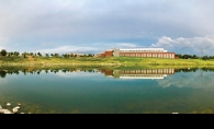 A shot of the Maple Grove Government Center reflected in a nearby body of water.