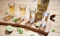 A tequila flight featuring different brands and types of tequila.