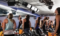 Participants cycle during a class at Surge Cycling in Maple Grove.