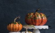 Three hand-decorated pumpkin centerpieces.