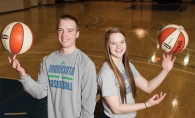 Brandon and Mackenzie Barta demonstrate their ball handling skills on the Minnesota Lynx practice court at Target Center. 