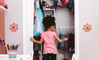 A child cleans their closet.