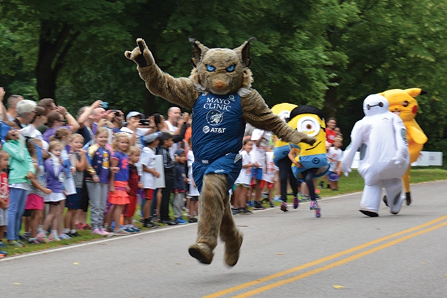 The Minnesota Lynx mascot runs the Reading is Fun 5K