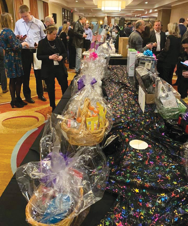 Silent auction tables at A Night Out of This World.