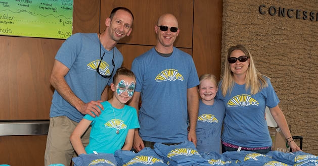 Jeremy and Nora Mickelson, Mark and Elizabeth Steil and Janet Reed sold T-shirts. 