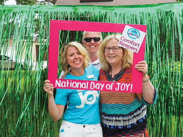 Jennifer Bauernfeind, Mark Carpenter (co-chair of Age Friendly Maple Grove) and Nany Carpenter (secretary of Age Friendly Maple Grove) at the Comfort Keepers National Day of Joy 2019