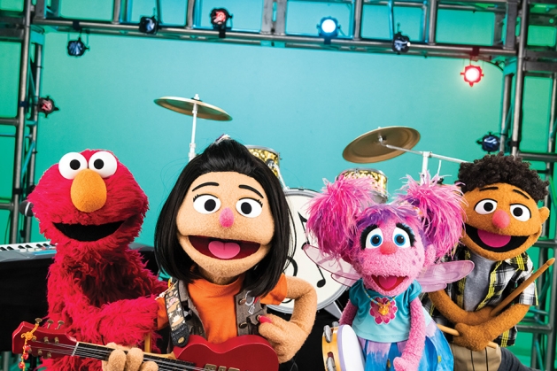 A band of Sesame Street Muppets including Ji-Young.