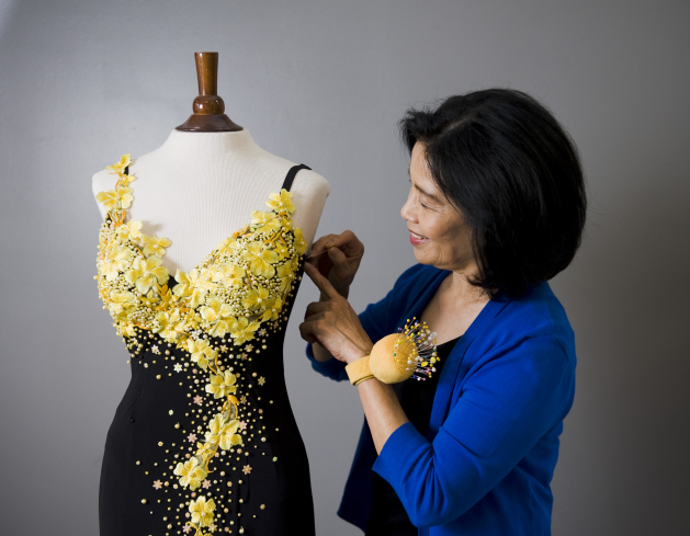 Ann Tran designs and alters clothing for her customers in Maple Grove