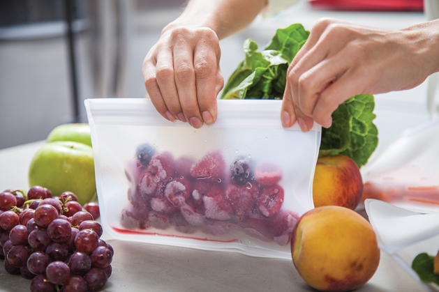 Preparing produce for the refrigerator.