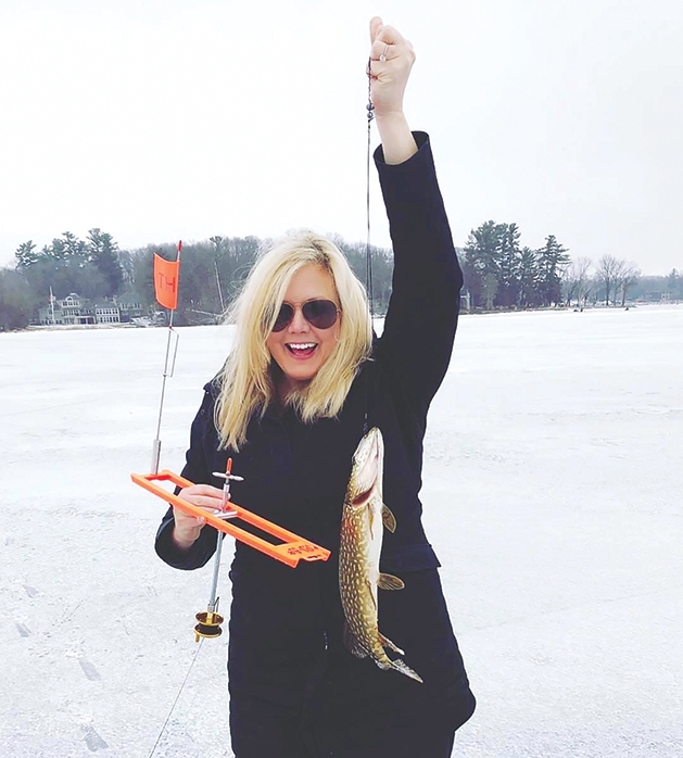 Local angler holding her catch.