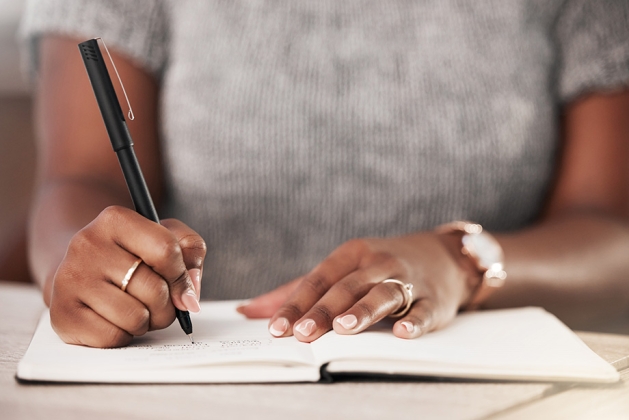 A woman writing.