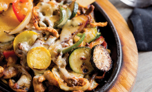 A plate of fajitas from Fiesta Cancun, an authentic coastal Mexican restaurant in Maple Grove.