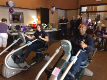 Members of law enforcement ride NuSteps at an Alzheimer's Association event.