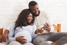 Pregnant couple counting baby's kicks in utero