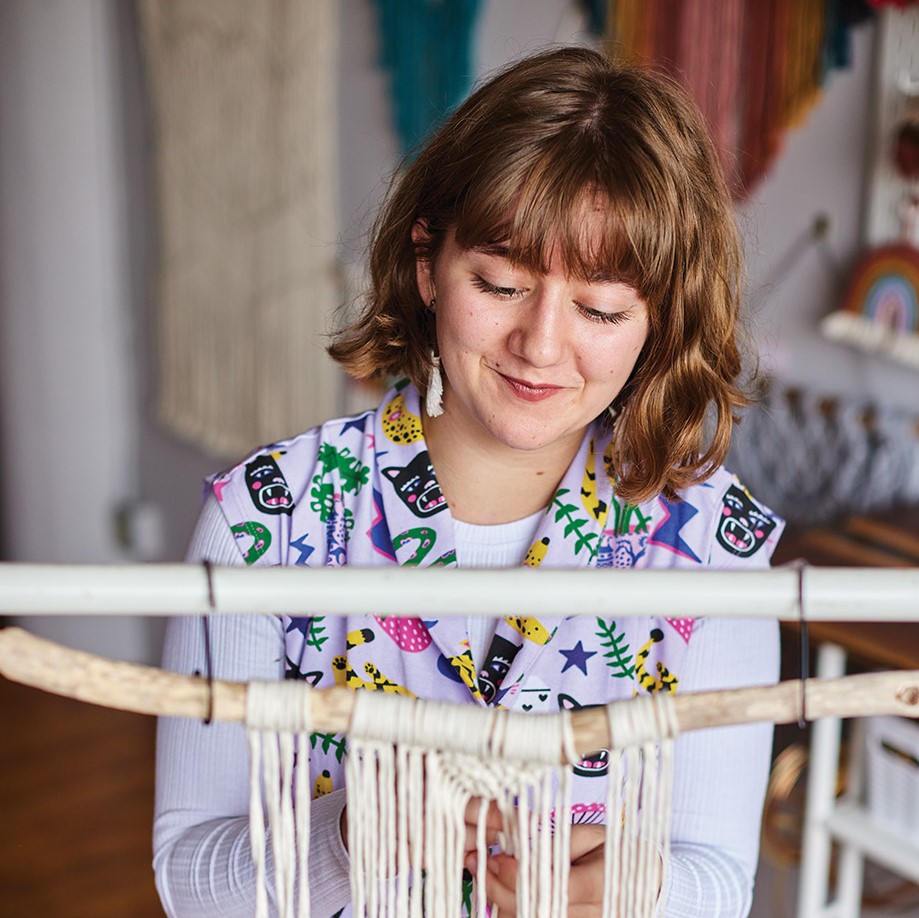 Macey LeVahn creating macramé. 