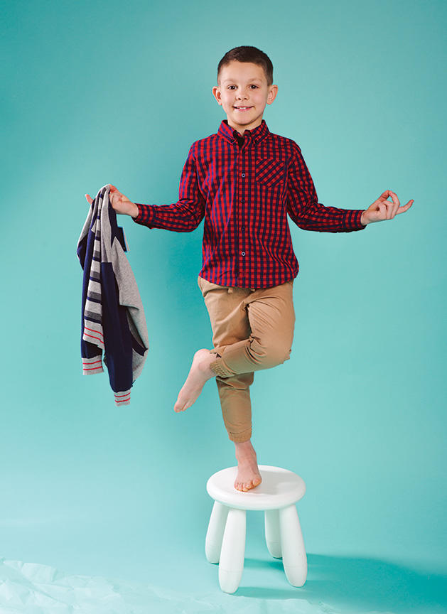 A child models clothing from Honey P's