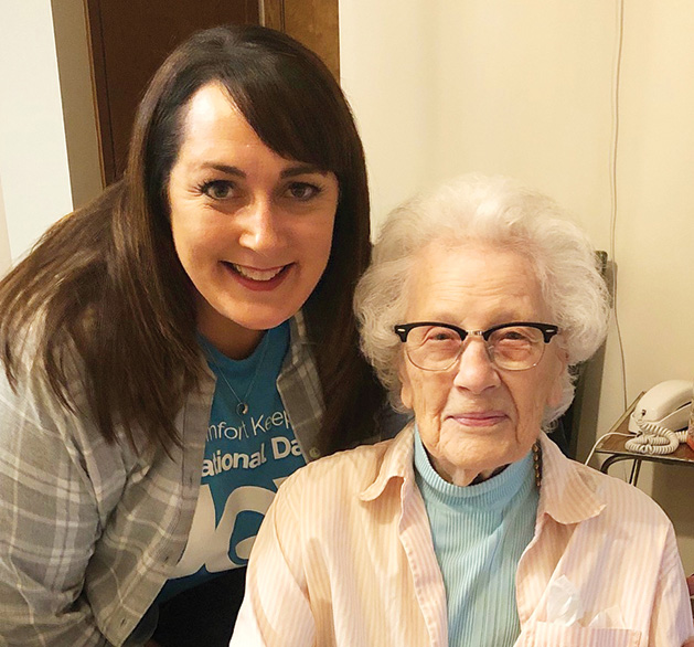 A caregiver from Comfort Keepers and a woman drawing.