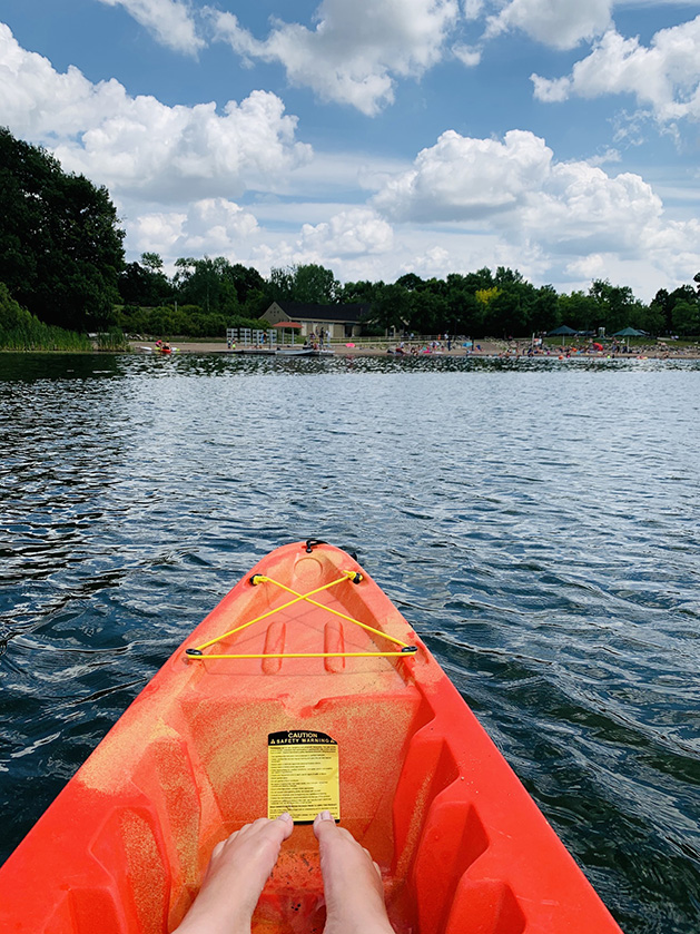 A person kayaking on Fish Lake.